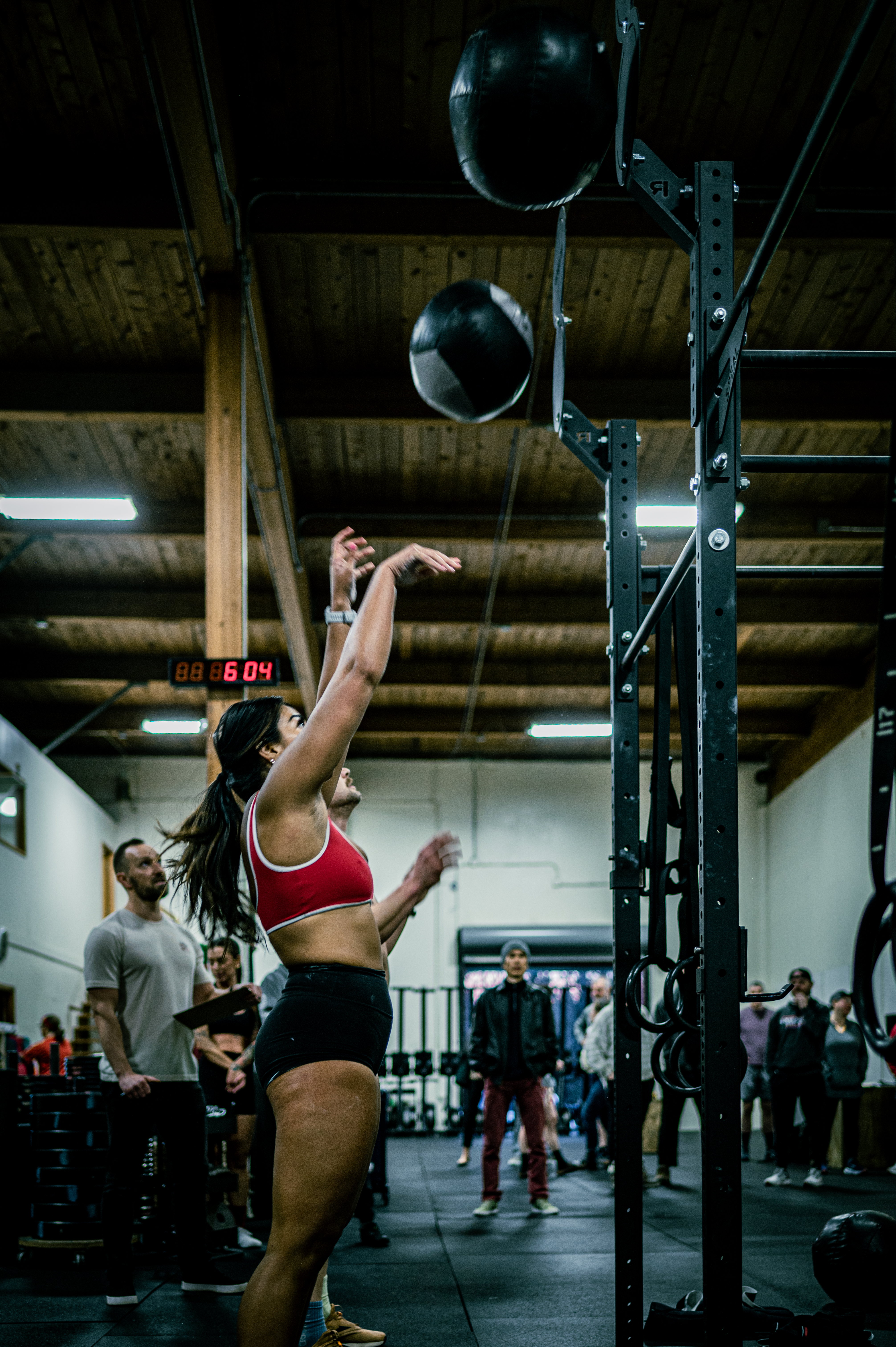 Teen athlete training with medicine ball during CrossFit Teens class (ages 9 to 14) in Tigard, Oregon